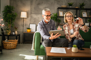 Mature couple husband and wife read recipe and instructions for medicament