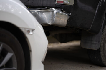 A damaged car on the road after a crash, showing collision impact, danger, injury risk, insurance...