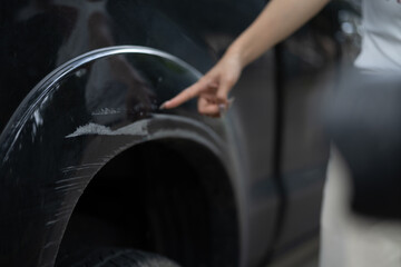 A damaged car on the road after a crash, showing collision impact, danger, injury risk, insurance...