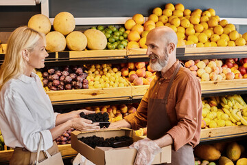 Customer finds fresh organic produce with friendly salesperson at local grocery store