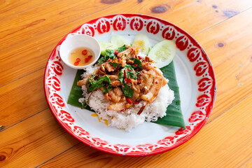 Thai food called Pad Basil with pork, basil leaves and chilli