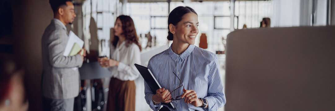 In a vibrant collaborative atmosphere, professionals engage in discussing innovative ideas within a modern workspace - Powered by Adobe