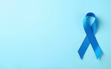 Blue ribbon on light blue background with copy space, cancer awareness, world diabetes day. High quality