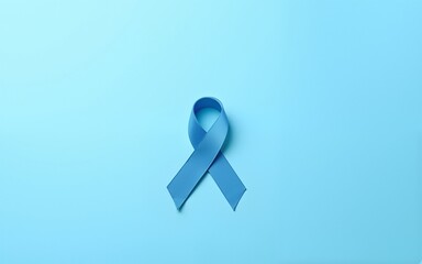 Blue ribbon on light blue background with copy space, cancer awareness, world diabetes day. High quality