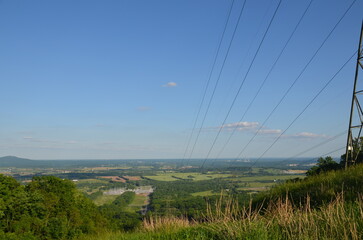 Wide Landscape View with Power Lines and Blue Sky