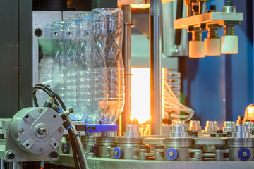 The drinking water bottle manufacturing process by blow mold machine.