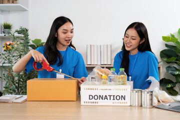 Volunteers teamwork packing donations for local charity