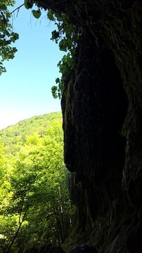 Beautiful slow motion video of the Sipote Waterfall (Cascadele de travertin) on a beautiful sunny summer day. Rain like water droplets falling from the travertine rocks giving a zen vibe. Alba,Romania