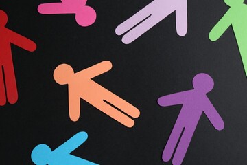 Tolerance concept. Colorful human figures on black background, flat lay