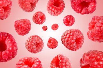 Fresh raspberries swirling in air against pink background