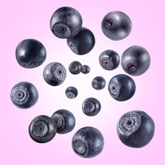 Fresh ripe blueberries swirling in air against violet gradient background
