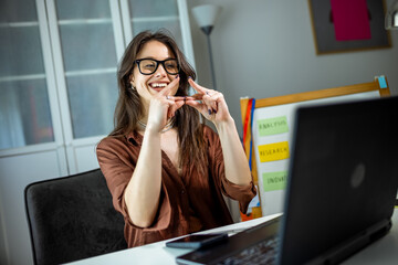 oung Woman Using Sign Language in Video Conference