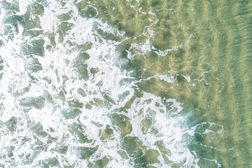 Obraz premium An Abstract Top Down View of a Wave and Sand Ripples. Concept The beautiful details of the sea.