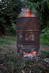 cleaning the area the barrel is used in the garden to burn garbage