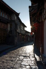 Sunrise Over Ancient Cobblestone Street in Traditional Chinese Village, Yunnan China
