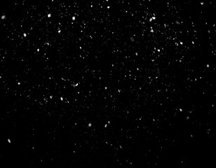 Snowflakes falling on a black background