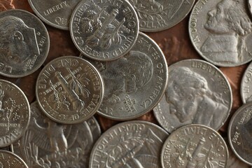 Pile with big amount of silver american cent coins as United States currency
