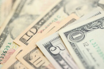 Many dollar bills banknotes in different denominations