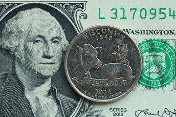 American cent coin on dollar bill close up. United States currency