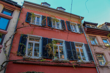 Obraz premium old red house with shutters in freiburg, germany