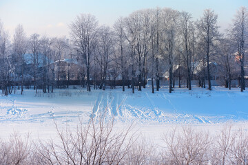 Winter landscape. Trees and plants covered with snow. The beauty of snow covered paths. Snowfall and cooling in tourist areas.