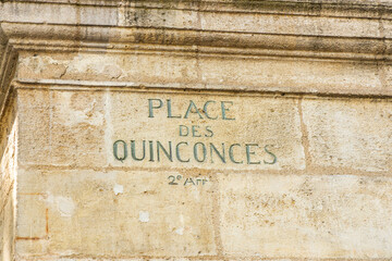 Place des Quinconces sign on the Fountain of the squre in Bordeaux, France