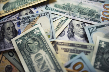 Group of money stack of 100 US dollars banknotes a lot of the background texture. Cash money in a...