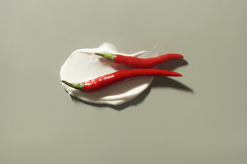 Cosmetic beauty product texture sample swatch. Hot anti cellulite body cream or face mask or hair scalp (hair fall control with pepper