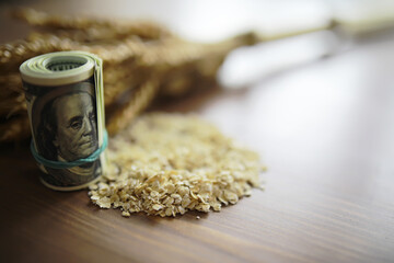 The concept of the cost of grain. 5000 ruble banknotes around a handful of ground grain. World...