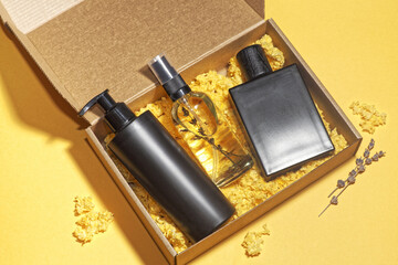 Cosmetic products beauty box. Black dispenser bottle, transparent glass spray bottle with oil or...