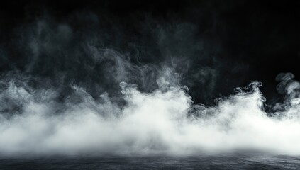 Fototapeta premium Black background with white smoke on the ground, creating an abstract and atmospheric effect.