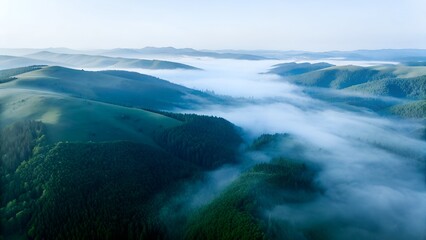 Fototapeta premium misty mountain valley with rolling green hills misty