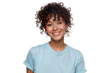 Beautiful smiling woman with curly hair looking directly at the camera, wearing a casual light blue t-shirt, isolated on white background