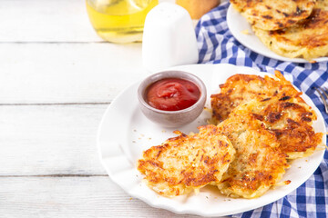 Homemade Hashbrown, Potato pancakes, fried crispy grated potato patties. Traditional dish of American, German cuisine. ideas comfort fall food lunch or brunch, Oktoberfest or Thanksgiving day breakfas