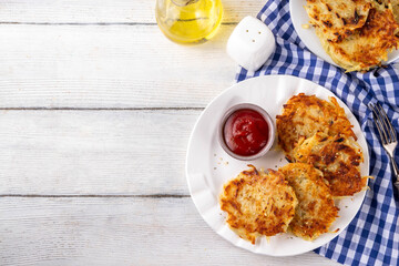 Homemade Hashbrown, Potato pancakes, fried crispy grated potato patties. Traditional dish of American, German cuisine. ideas comfort fall food lunch or brunch, Oktoberfest or Thanksgiving day breakfas
