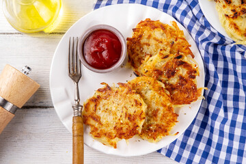Homemade Hashbrown, Potato pancakes, fried crispy grated potato patties. Traditional dish of American, German cuisine. ideas comfort fall food lunch or brunch, Oktoberfest or Thanksgiving day breakfas