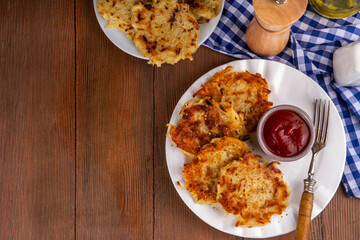 Homemade Hashbrown, Potato pancakes, fried crispy grated potato patties. Traditional dish of American, German cuisine. ideas comfort fall food lunch or brunch, Oktoberfest or Thanksgiving day breakfas