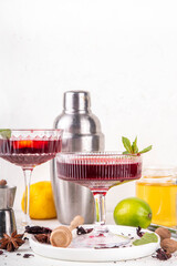 Tasty sweet sour aromatic hibiscus  cocktail with alcohol, spices, honey, lemon or lime juice, copy space 