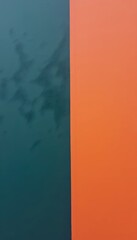 A close up of a blue and orange wall.