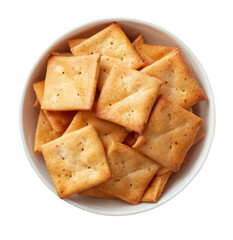 Fototapeta premium Square crackers in a white bowl. Golden-brown, slightly textured crackers. A top-down view