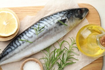 Fresh raw mackerel and spices on table, flat lay. Seafood delicacies