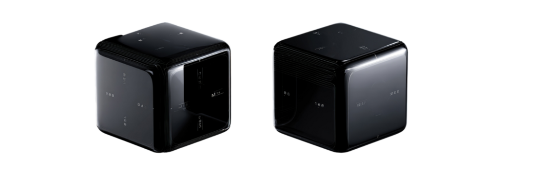 Two black, cube-shaped audio speakers.  Glossy, modern design