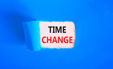 Time change symbol. Concept word Time change on beautiful white paper. Beautiful blue paper background. Business time change concept. Copy space.