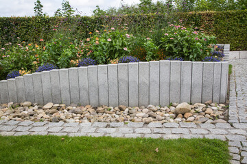 Modern Garden Design and Landscaping:Raised bed fenced by concrete blocks in different heights...