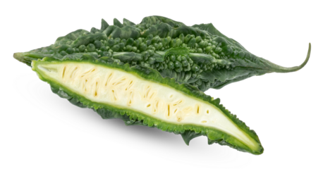 halved and whole bitter melon on black backdrop