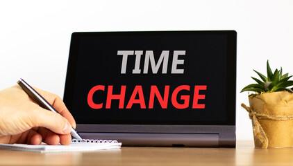 Time change symbol. Concept word Time change on beautiful black tablet. Businessman's hand with pen. Calculator. Beautiful white background. Business time change concept. Copy space.