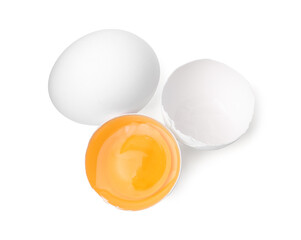 Whole and broken chicken eggs isolated on white, top view