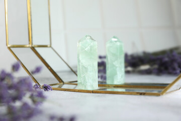 Aura. Beautiful fluorite and lavender on white table, closeup