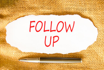 Follow up symbol. Concept word Follow up on beautiful white paper. Beautiful canvas background....