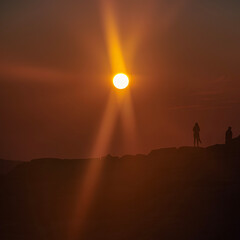 people watching sunset